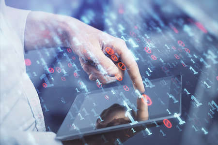 Double exposure of mans hand holding and using a digital device and data theme hologram drawing....