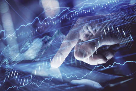 Multi exposure of mans hands holding and using a phone and financial chart drawing. Market analysis...