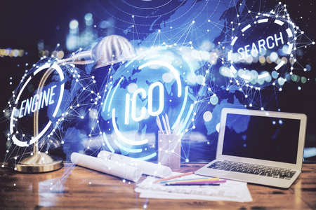 Double exposure of blockchain and crypto economy theme hologram and table with computer background....