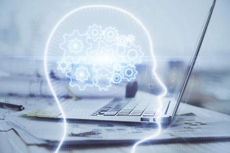 Multi exposure of work table with computer and brain hologram. Brainstorm concept.の写真素材