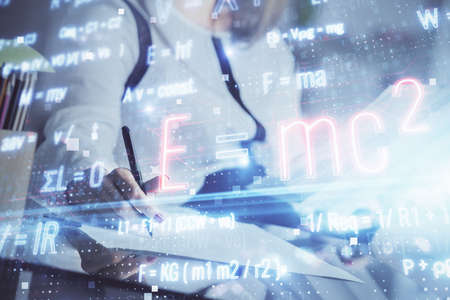 Science formula hologram over womans hands taking notes background. Concept of study. Multi exposure