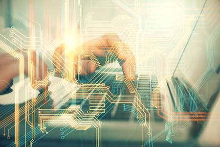 Multi exposure of world map hologram with man working on computer on background. Concept of...