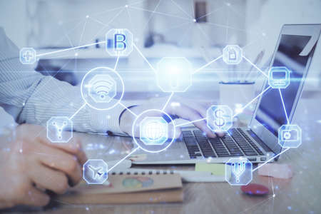 Social network theme hologram with businessman working on computer on background. Concept of world...
