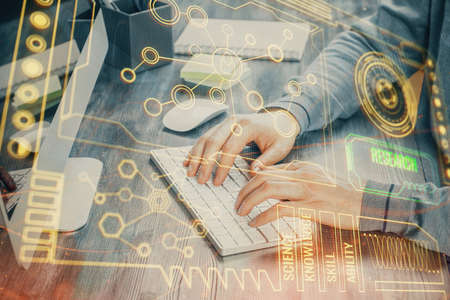 Double exposure of tech drawings with hands working on computer background. Concept of innovation.