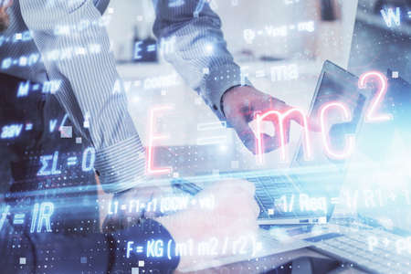 Science formula hologram with man working on computer on background. Education concept. Double...