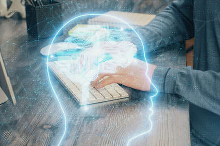 Man with computer background with brain theme hologram. Concept of brainstorm. Double exposure.