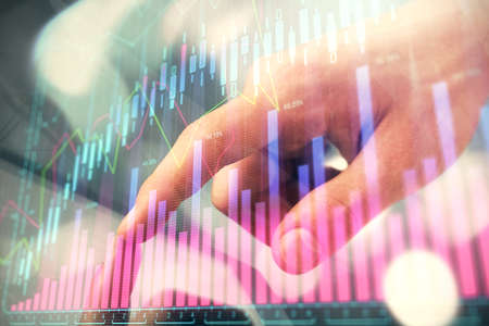 Multi exposure of mans hands holding and using a phone and financial chart drawing. Market analysis...