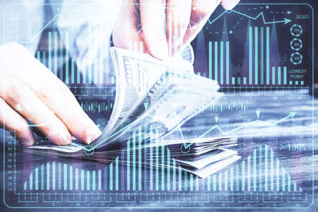 Multi exposure of forex graph drawing hologram and USA dollars bills and man hands. Technical...