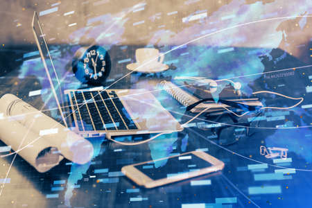 Double exposure of table with computer on background and data theme drawing. Concept of innovation.