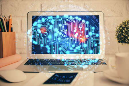 Double exposure of work space with computer and human brain drawing hologram. Brainstorm concept.