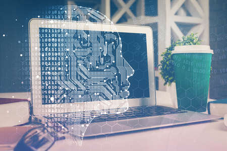 Double exposure of work space with computer and human brain drawing hologram. Brainstorm concept.
