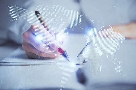 Social network theme hologram over hands taking notes background. Concept of global international...