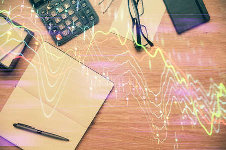 Double exposure of forex graph drawing and work table top veiw. Concept of financial analysis.