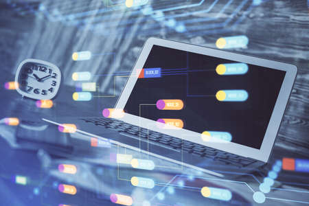 Double exposure of laptop computer and technology theme hologram. Concept of freelance work.