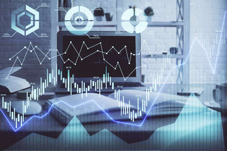 Stock market chart hologram drawn on personal computer background. Multi exposure. Concept of...