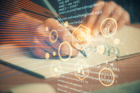 Double exposure of writing hands on background with data solution hologram on front. Technology...