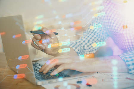 Businessman with computer background with technology theme hologram. Concept of big data. Double...