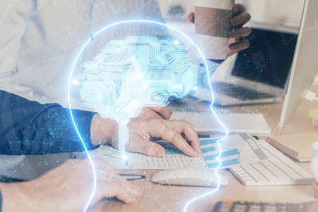 Man with computer background with brain theme hologram. Concept of brainstorm. Double exposure.の写真素材