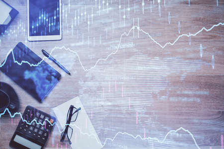 Double exposure of forex graph drawing and work table top veiw. Concept of financial analysis.