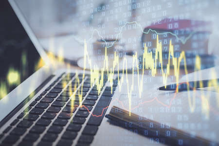 Double exposure of financial chart drawing and desktop with coffee and items on table background....