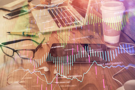 Double exposure of financial graph drawing and cell phone background. Concept of forex trading