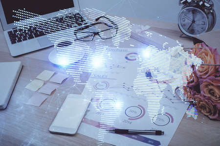Computer on desktop with social network hologram. Double exposure. Concept of international people...