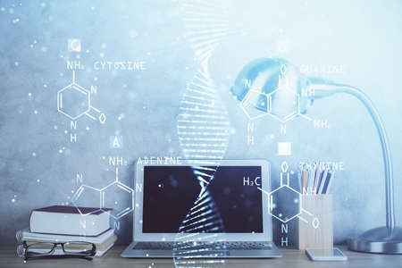 Desktop computer background and DNA drawing. Double exposure. Science concept.の写真素材
