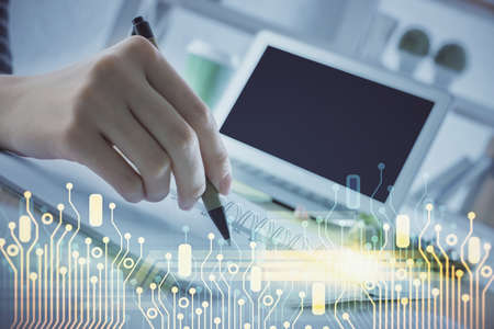 Double exposure of hands making notes with digital coding icons. Computer learning concept.