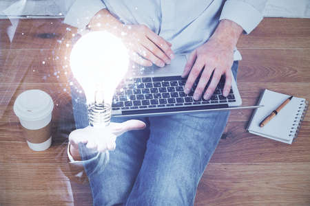 Growing arrows with businessman working on computer on background. Success concept. Double exposure.の写真素材