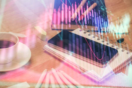 Double exposure of forex chart drawing and cell phone background. Concept of financial trading