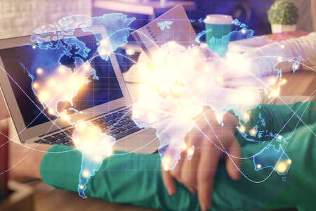 Double exposure of man and woman working together and financial theme hologram. international...