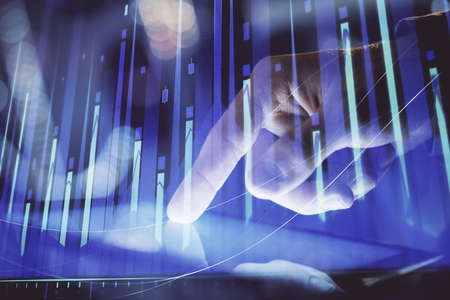 Multi exposure of mans hands holding and using a phone and financial chart drawing. Market analysis...