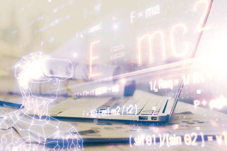Desktop computer background and formula hologram writing. Double exposure. Education concept.