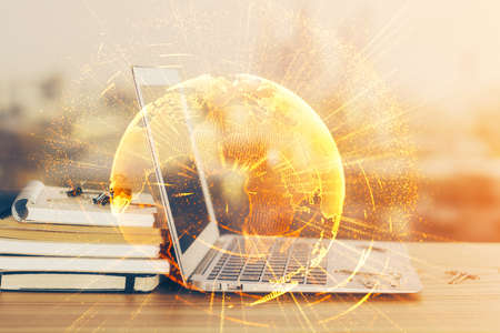 Computer on desktop with social network theme icon. Multi exposure. Concept of international connections.の写真素材