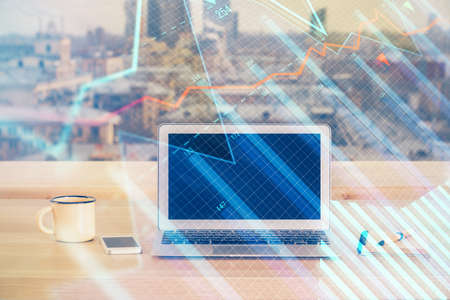 Double exposure of forex chart and work space with computer. Concept of international online...