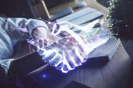 Handshake drawing over hands taking notes background. Concept of success. Double exposureの写真素材