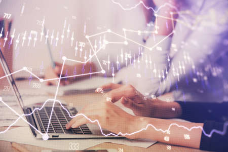 Multi exposure of woman hands typing on computer and financial chart hologram drawing. Stock market...