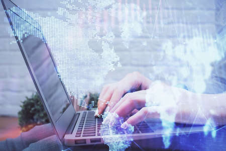 Multi exposure of woman hands typing on computer and forex chart hologram drawing. Stock market...