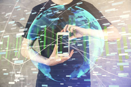Double exposure of mans hands holding and using a phone and international business theme drawing.