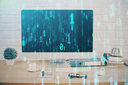 Double exposure of table with computer on background and data theme hologram. Data technology...