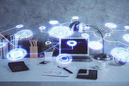 Computer on desktop with social network hologram. Double exposure. Concept of international people connections.の写真素材