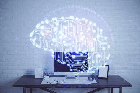 Multi exposure of work space with computer and human brain hologram. Brainstorm concept.