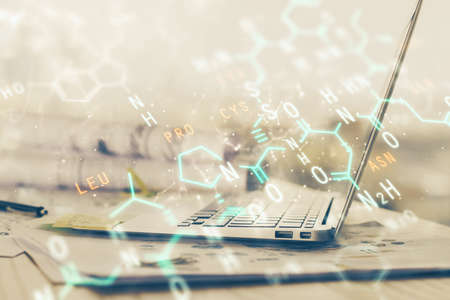 Desktop computer background and formula hologram writing. Double exposure. Education concept.の写真素材