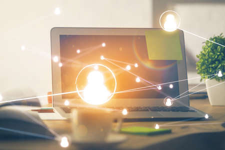 Computer on desktop with social network theme icon. Multi exposure. Concept of international...