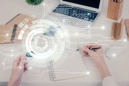 Double exposure of writing hand on background with data technology hologram. Big data concept.