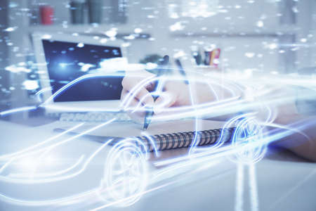 Tech autopilot theme hologram over womans hands taking notes background. Concept of hightech. Double exposureの写真素材