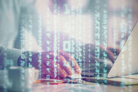 Businessman with computer background with technology theme hologram. Concept of hightech. Multi...