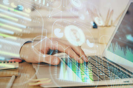 A man working on Laptop with technology theme drawing. Concept of big data. Double exposure.
