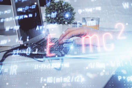 Science formula hologram with man working on computer on background. Education concept. Double...