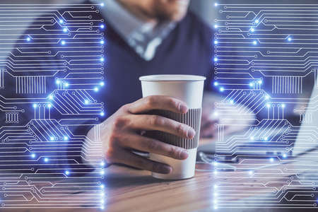 Technology theme hologram with man working on computer on background. High tech concept. Multi exposure.の写真素材